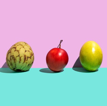 fruit variation of tropical fruits on a rose turquoise background