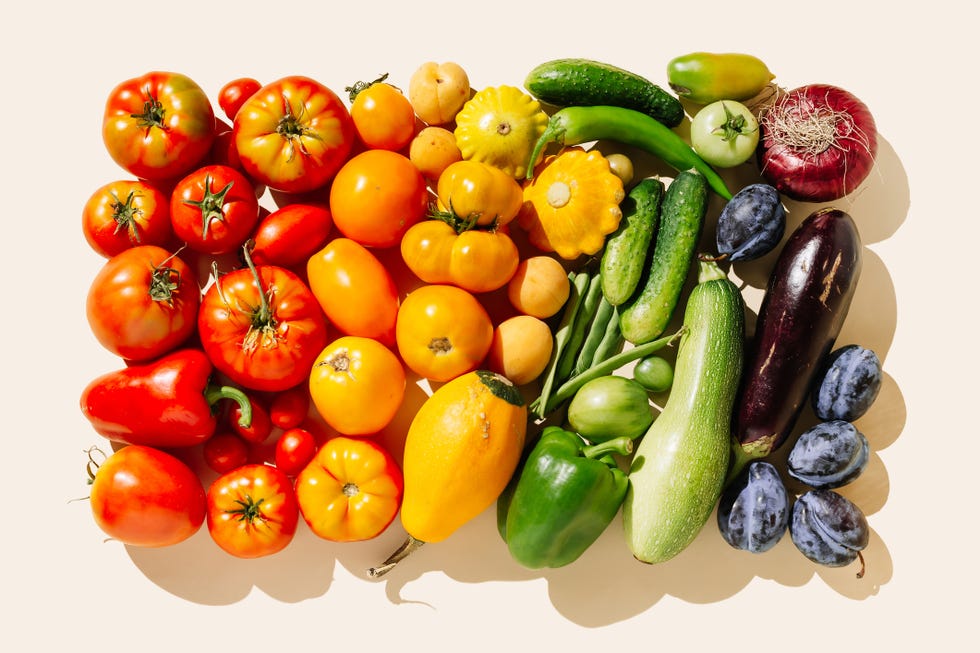variety fresh of organic fruits and vegetables rainbow colors on beige background healthy food, clean eating, diet and detox concept flat lay, top view