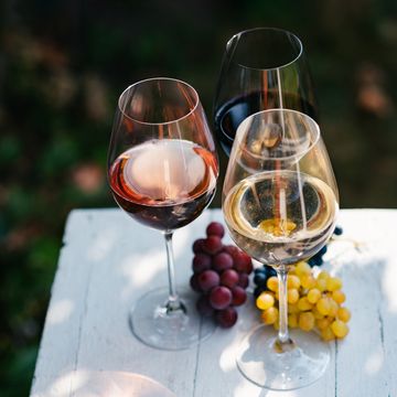 variety of wine for tasting on table in vineyard