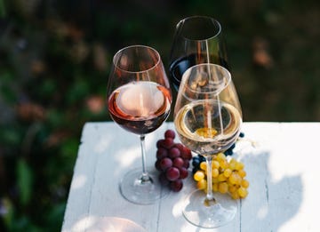 variety of wine for tasting on table in vineyard