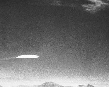 ufo flying over new mexico in black and white image