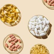 various pills and capsules, vitamins and dietary supplements in petri dishes on a beige background, vitamins for immune system
