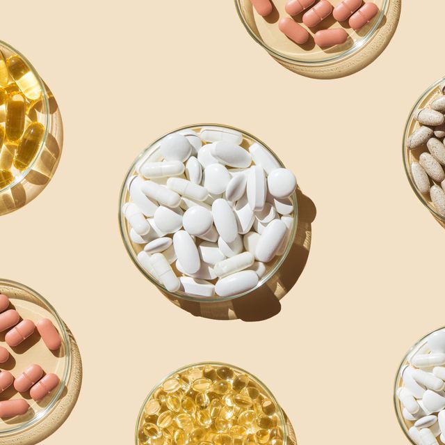 various pills and capsules, vitamins and dietary supplements in petri dishes on a beige background