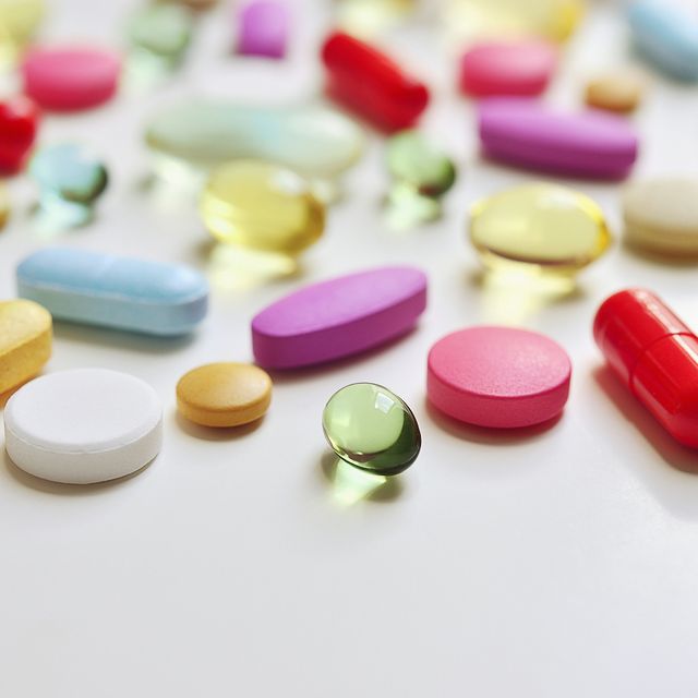 various pills lying on a white surface