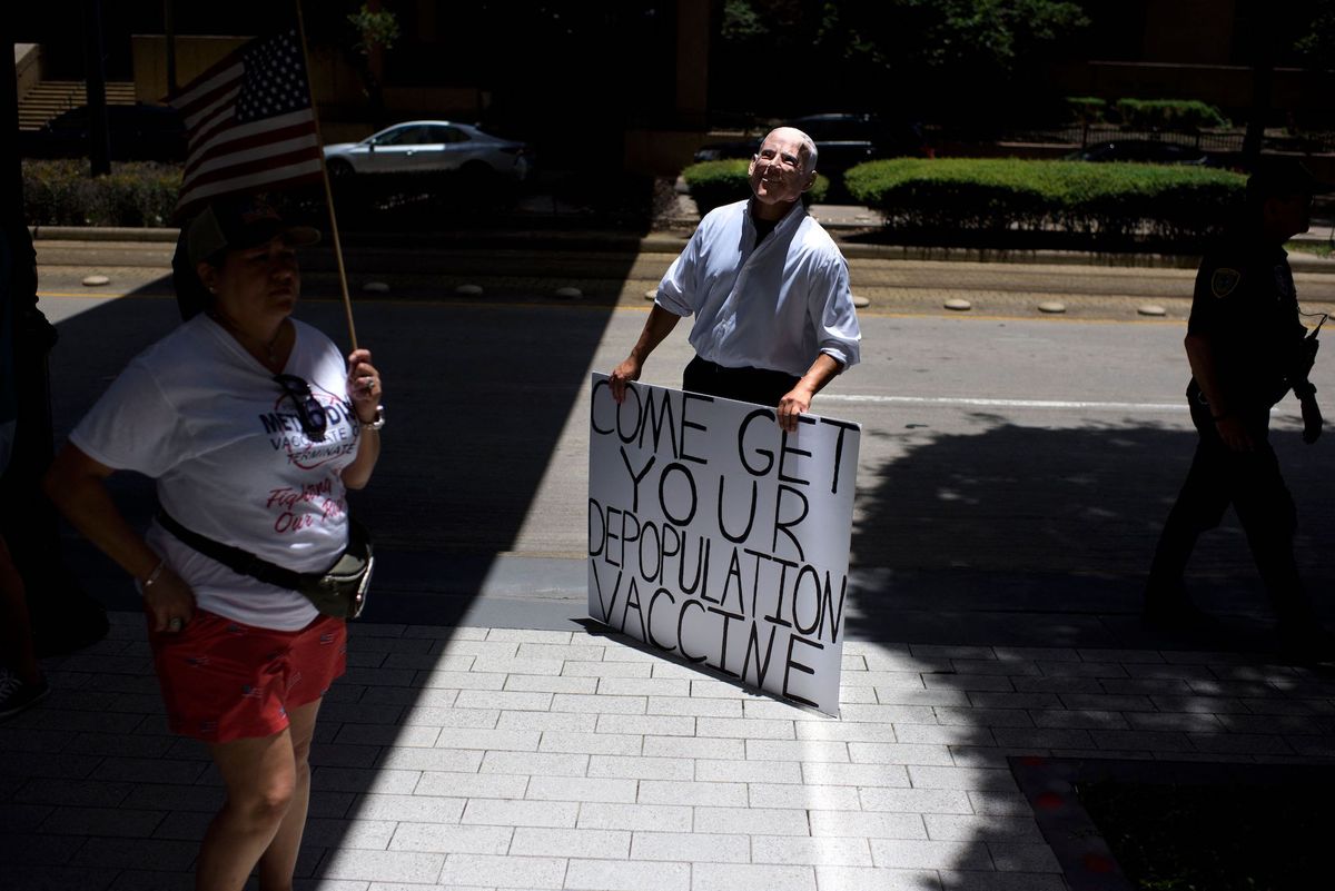 an anti vaccine rally protester dressed up as joe biden holds a sign outside of houston methodist hospital in houston, texas, on june 26, 2021   a spokesperson for houston methodist hospital said on june 23, 153 employees either resign or were fired for refusing to be vaccinated photo by mark felix  afp photo by mark felixafp afp via getty images