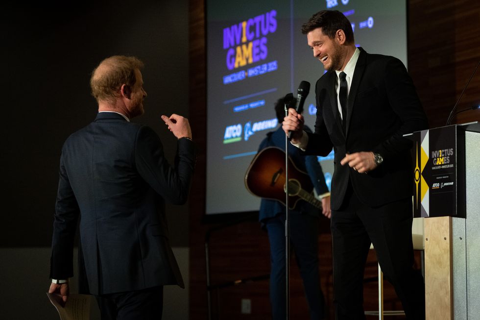prince harry, the duke of sussex walks to the stage after canadian signer and songwriter, michael buble's performance during the "one year to go invictus games dinner in vancouver on friday, feb 16, 2024 the canadian pressethan cairns
