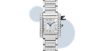 womens luxury watch with diamond accents and blue hands featuring roman numerals