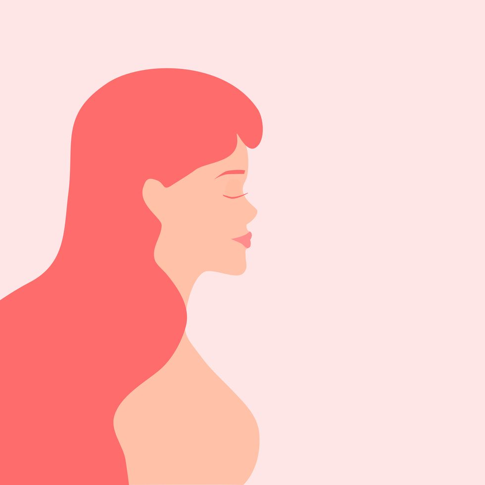 vector of a woman with long hair in pink colors concept of feminism