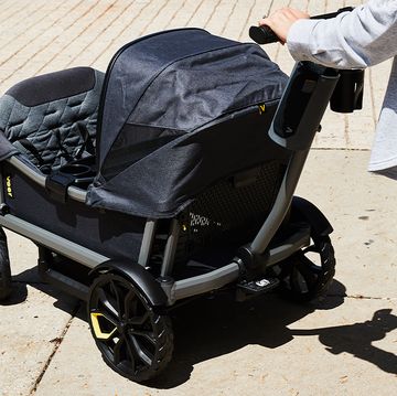 a person pushing the veer xl stroller wagon