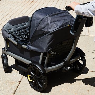 a person pushing the veer xl stroller wagon