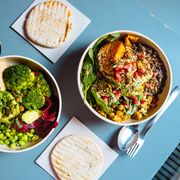 Vegan bowls with various vegetables and seeds, high angle view