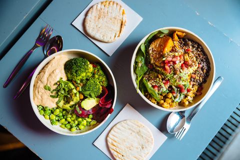 vegan bowls with various vegetables and seeds