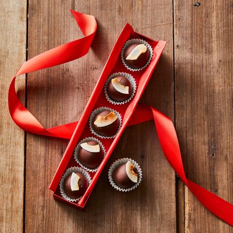 vegan chocolate truffles in red box on wood table