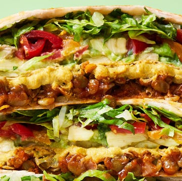 Vegan Crunchwrap Supreme vegan crunchwrap supreme filled with cooked lentils, avocado, tomatoes, and vegan cheese sauce