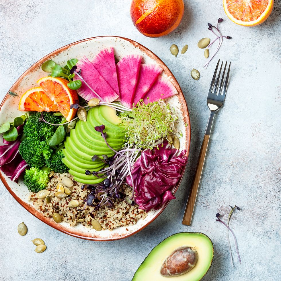 vegan, detox buddha bowl with quinoa, micro greens, avocado, blood orange, broccoli, watermelon radish, alfalfa seed sproutstop view, flat lay, copy space