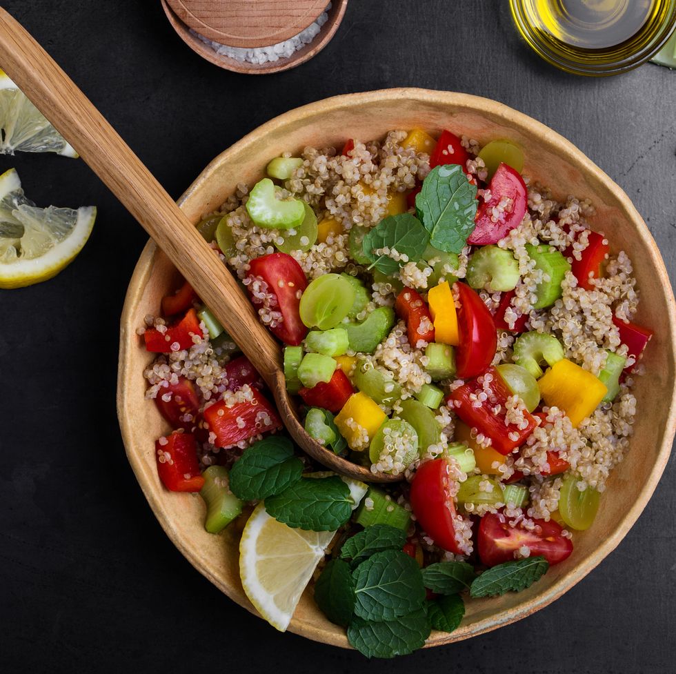 Quinoa salad with red and yellow bell peppers tomatoes, celery and grapes