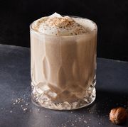 vegan eggnog topped with soy whipped cream and grated nutmeg