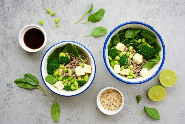 vegan noodles with green vegetables and tofu broccoli vegetables, edamame beans, spinach and sesame seeds