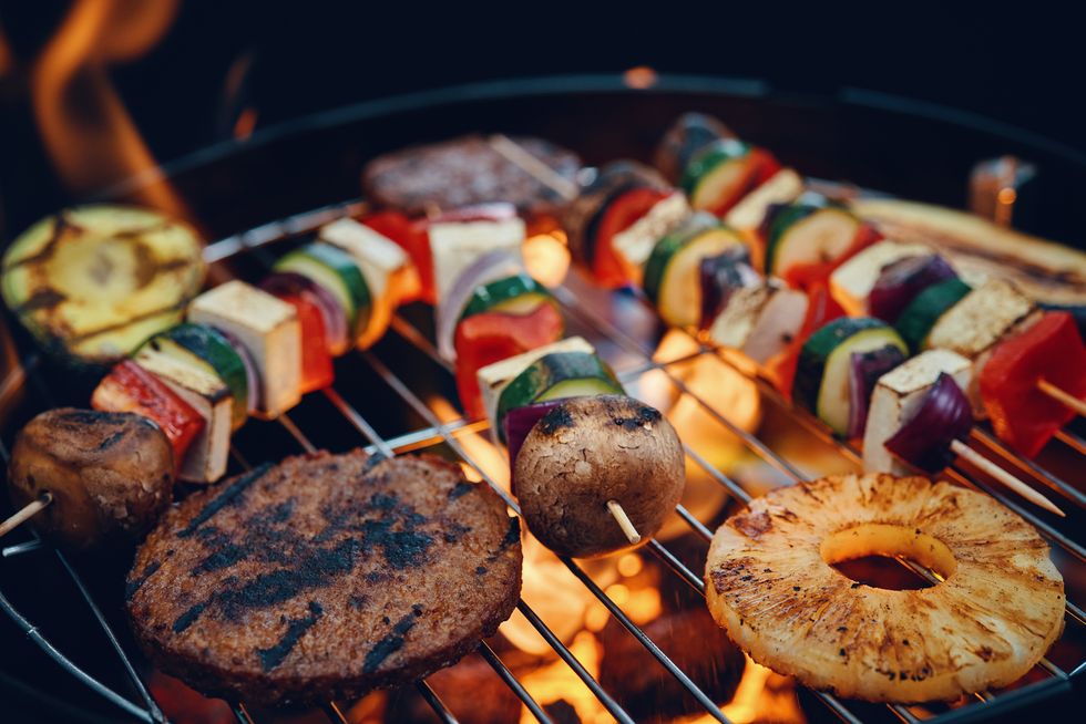 vegan skewers and vegan burger patties and vegetables for bbq grill