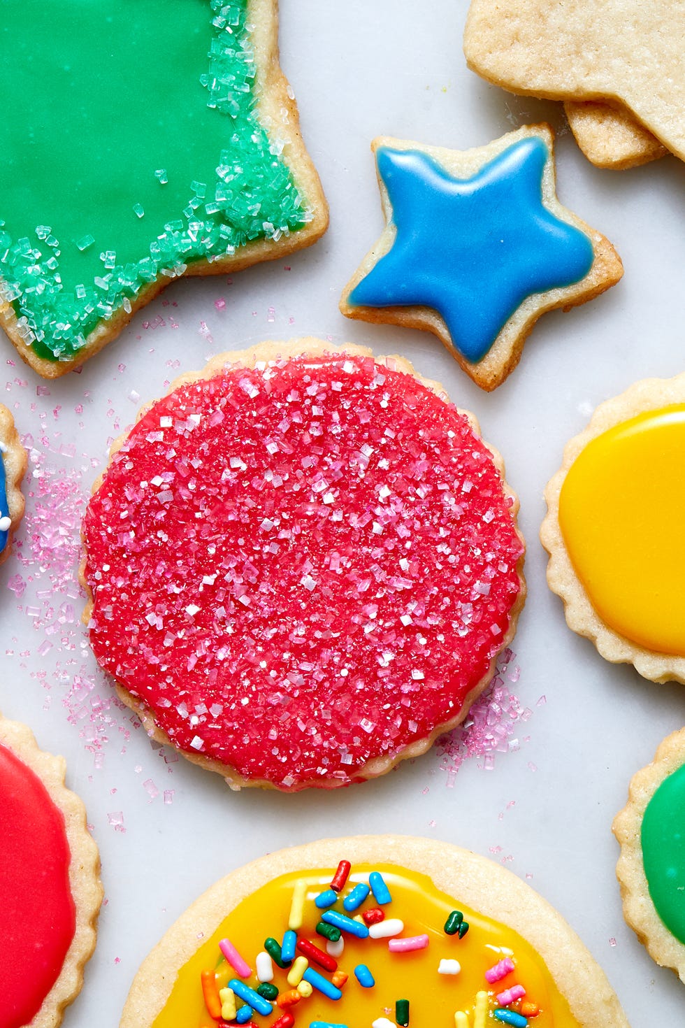 vegan sugar cookies iced and topped with sprinkles