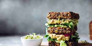 vegan super sandwich served with sprouts