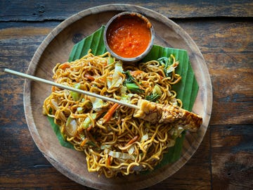 vegan tempeh skewer on balinese mie goreng fried noodles