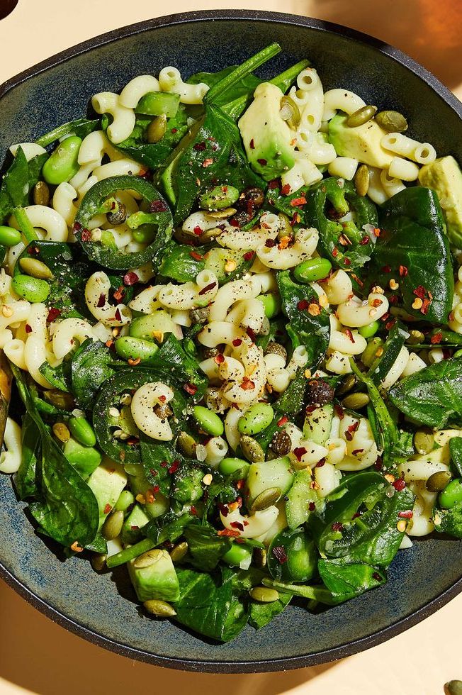 pasta salad with spinach, jalapenos, edamame, pumpkin seeds, and red pepper flakes