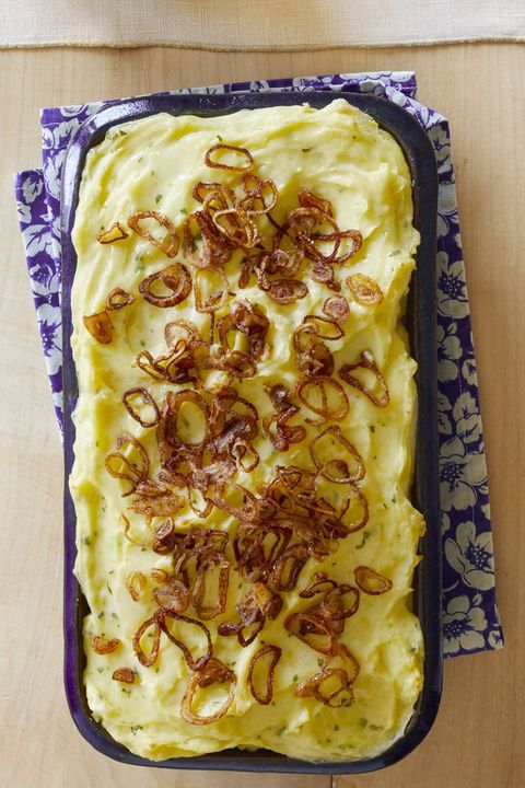 baked mashed potatoes with crispy shallots and blue floral napkin
