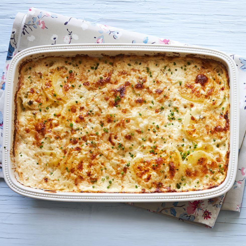 creamy potatoes with chives in white casserole dish