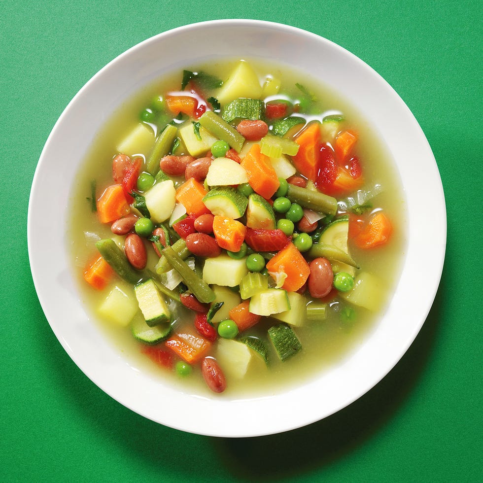 vegetable soup on a green backdrop vegetable soup on a green backdrop