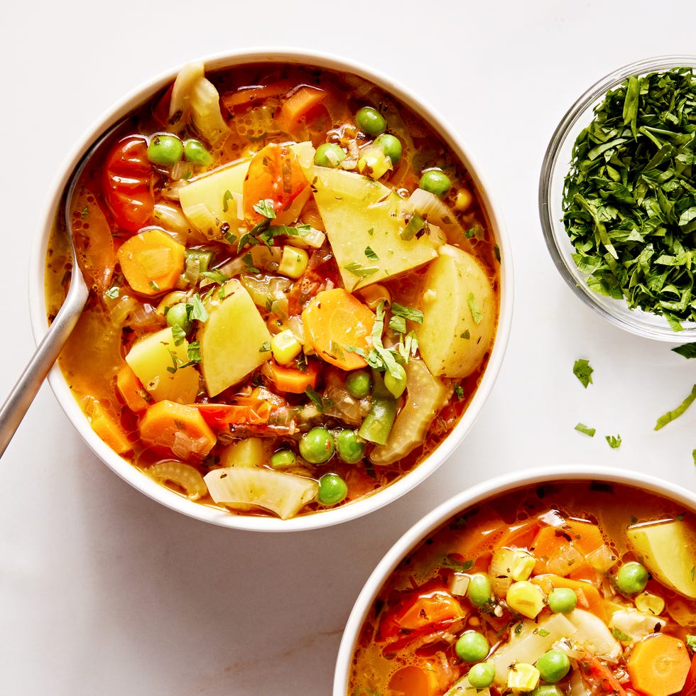 Premium Photo  Healthy homemade vegetable soup fresh and ready to eat - on  wooden table, parmesan cheese