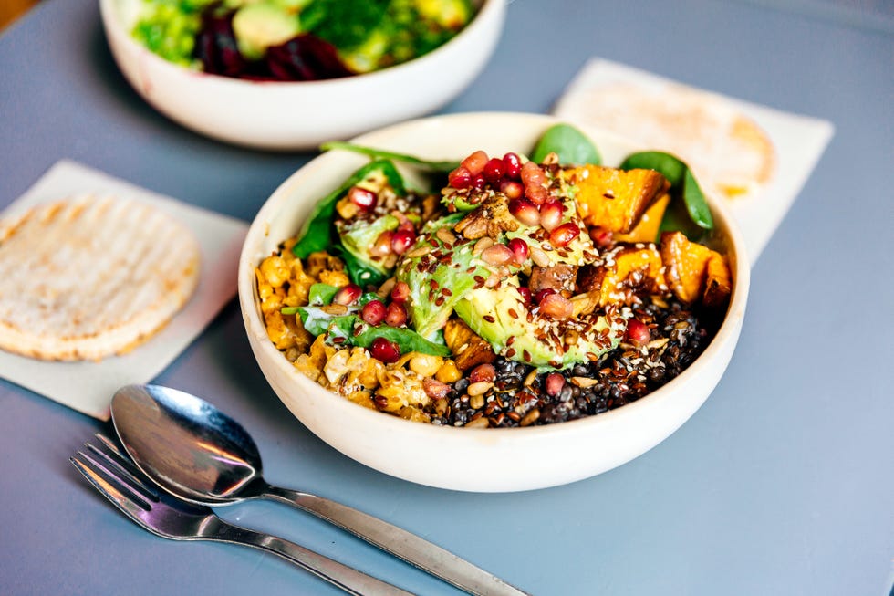 vegetarian bowl with avocado, pumpkin, lentil, pomegranate