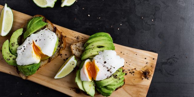 Vegetarian sandwiches with poached egg and sliced avocado