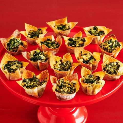 vegetarian super bowl recipes spinach artichoke cups on red surface