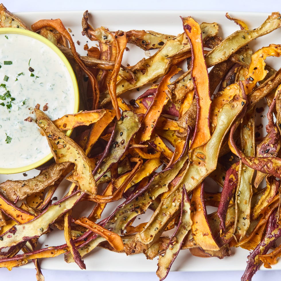 roasted veggie peels on a platter served with a creamy dip