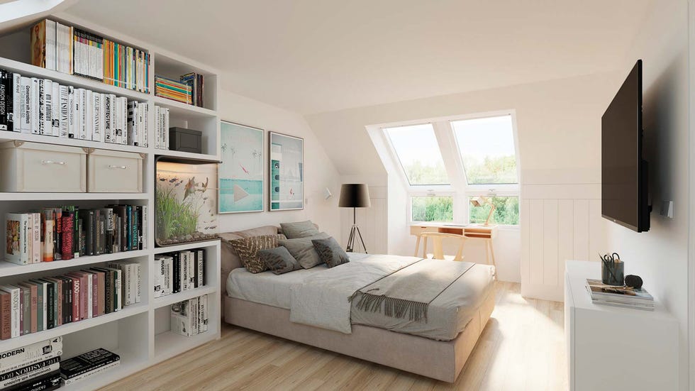 dormitorio abuhardillado con ventanas de techo