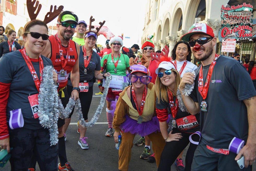 a group of runners dressed in christmas and holiday costumes