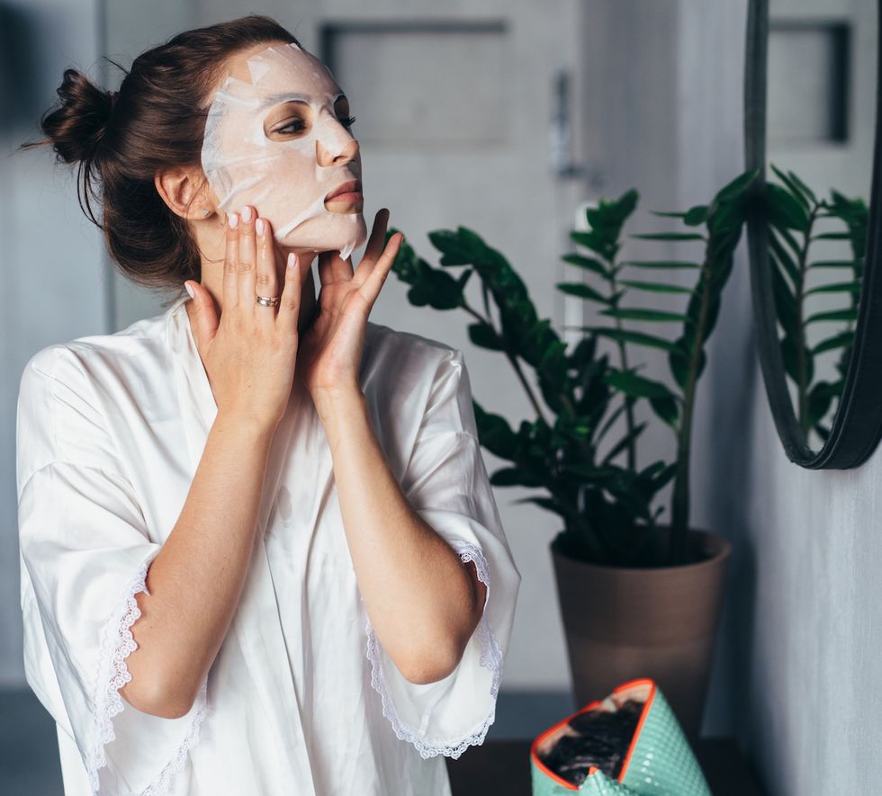 woman does facial rejuvenation treatments at home