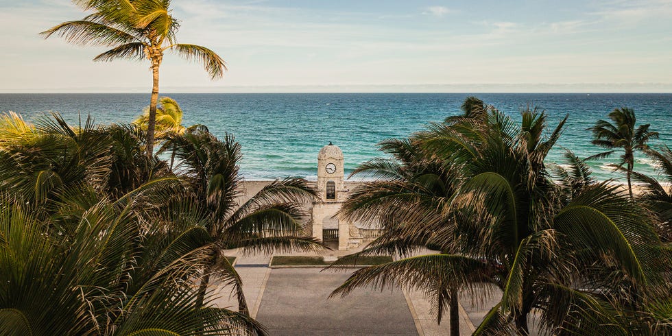 worth avenue clock tower on worth avenue, palm beach, florida aerial footage of the worth avenue clock tower on palm beach, fl during a very busy weekday in january 2021