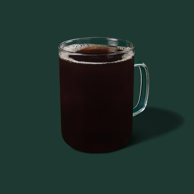 a glass of brown liquid
