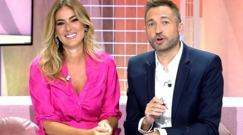 television hosts engaged in a discussion