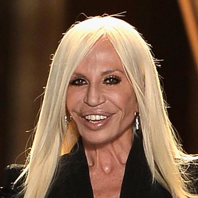 PARIS, FRANCE - JUNE 30:  Fashion designer Donatella Versace acknowledges applause following the  Versace show as part of Paris Fashion Week Haute-Couture Fall/Winter 2013-2014 at  on June 30, 2013 in Paris, France.  (Photo by Pascal Le Segretain/Getty Images)