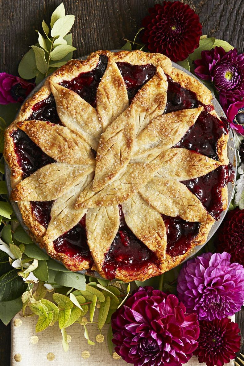 very berry apple pie surrounded by flours