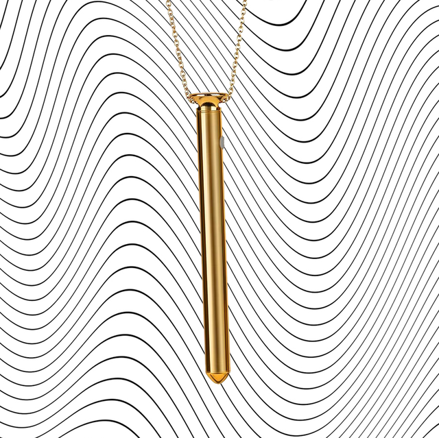 gold vibrator necklace on wavy background and on woman's neck