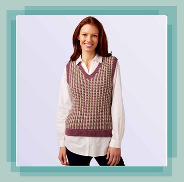 model wearing purple and cream striped knitted vest