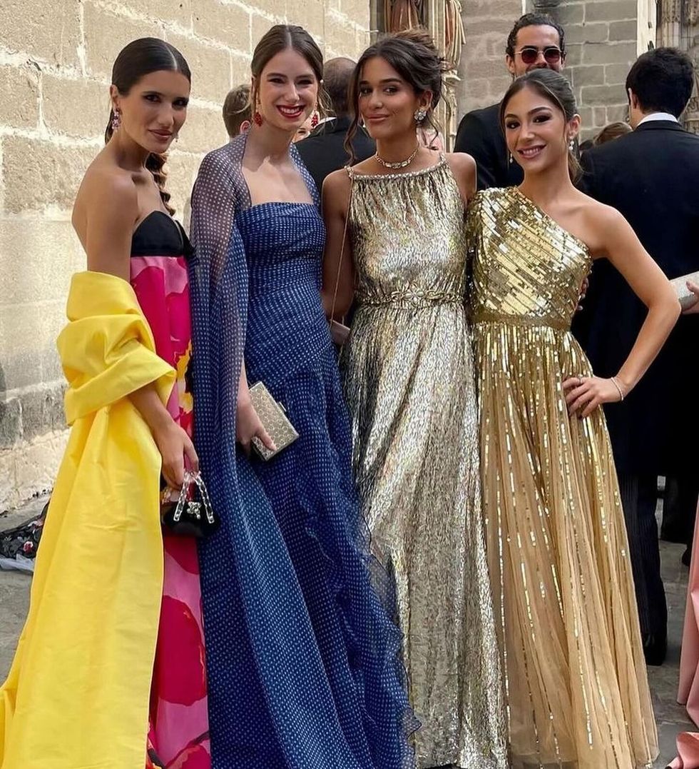 a group of women in dresses