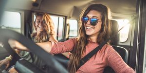 young happy women having fun on their road trip