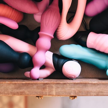 drawer full of vibrators and sex toys