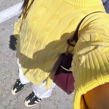 a woman in a yellow jacket