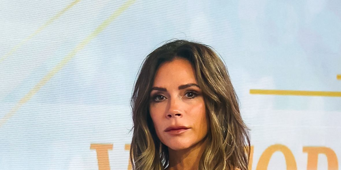 Victoria Beckham shows off her toned physique in a black lace bra